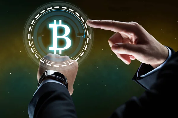 Businessman with smart watch and bitcoin hologram — Stock Photo, Image