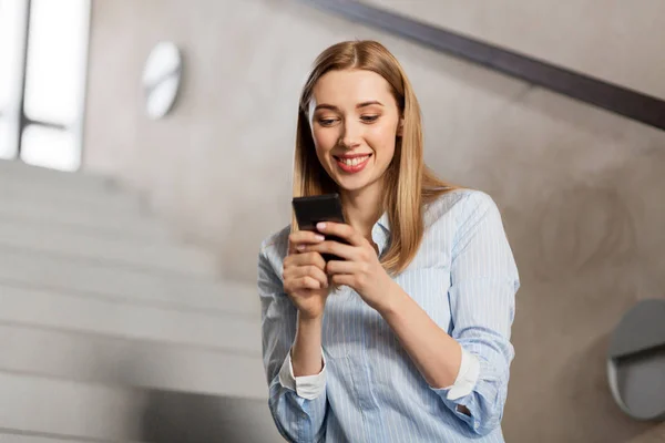 Woman or student with smartphone at office stairs — Stock Photo, Image