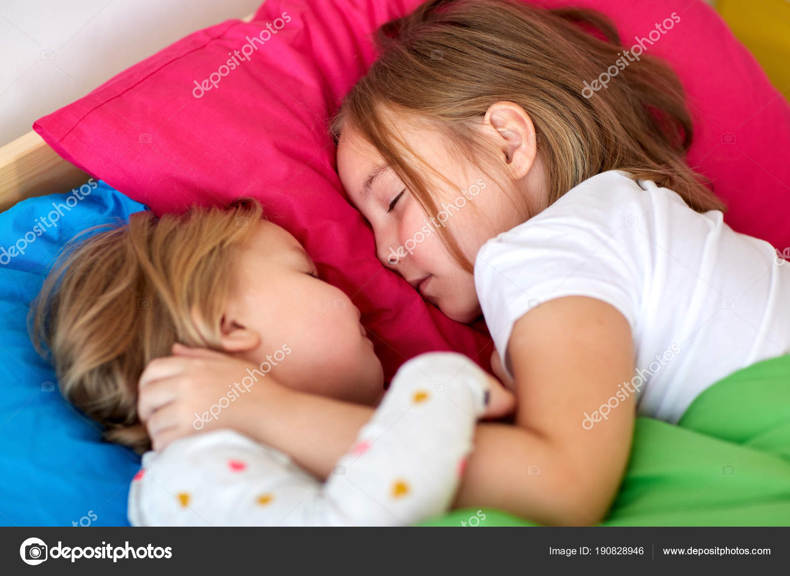 Happy little girls sleeping in bed at home ⬇ Stock Photo, Image by
