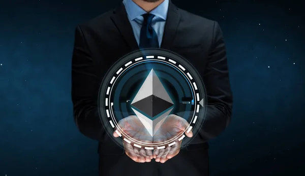 Close up of businessman with ethereum over space — Stock Photo, Image