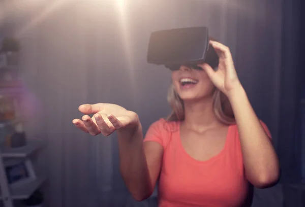 happy woman in virtual reality headset or glasses