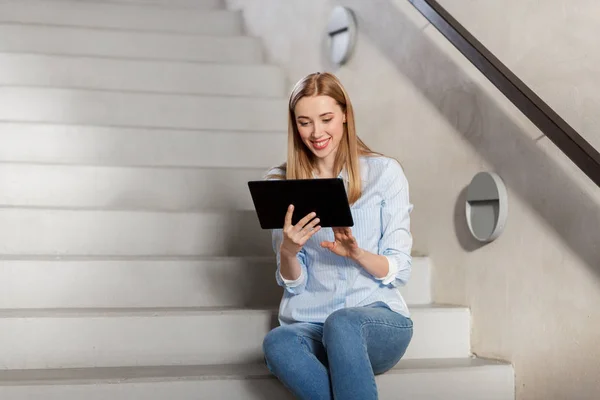 Woman or student with tablet pc sitting on stairs — Stock Photo, Image