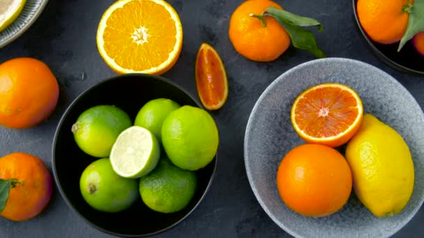 Close up of citrus fruits on stone table — Stock Video