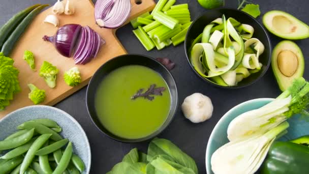 Close up of vegetable green cream soup in bowl — Stock Video