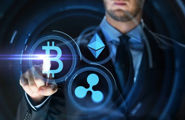 Businessman with at cryptocurrency icons — Stock Photo, Image