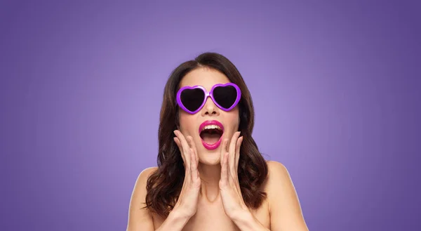 Woman with pink lipstick and heart shaped shades — Stock Photo, Image