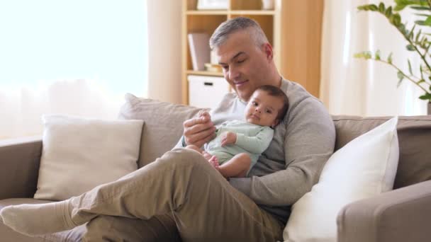 Happy father with little baby boy at home — Stock Video