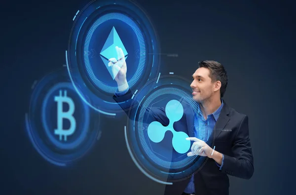 Hombre de negocios con hologramas criptomoneda — Foto de Stock