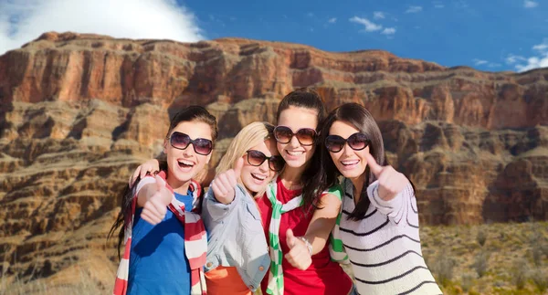 Teenage girls or young women showing thumbs up — Stock Photo, Image