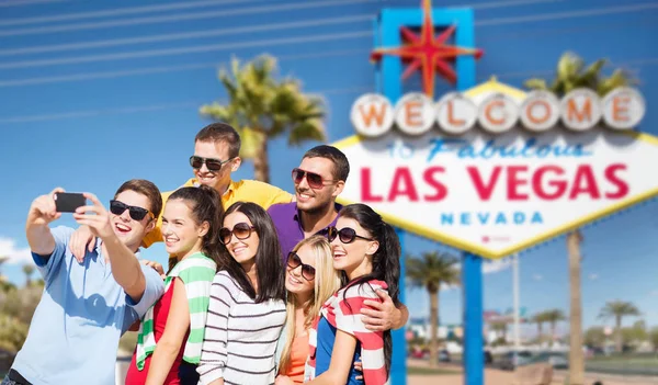 Group of happy friends taking selfie by cell phone — Stock Photo, Image