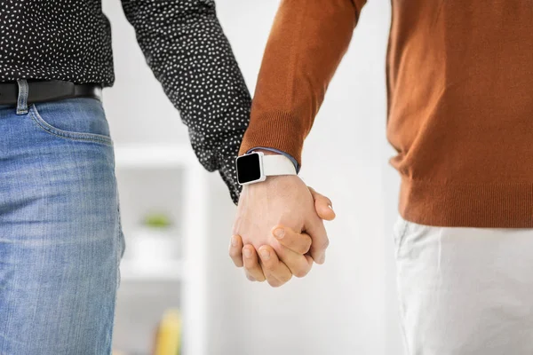 Close up of male gay couple hands with smart watch — Stock Photo, Image