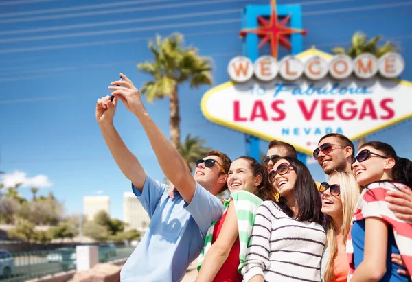 Group of happy friends taking selfie by cell phone — Stock Photo, Image