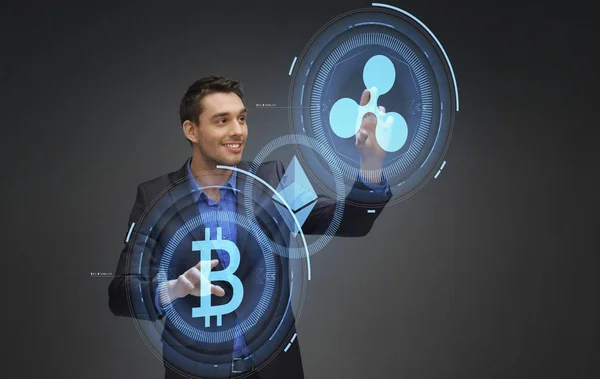 Businessman with cryptocurrency holograms — Stock Photo, Image