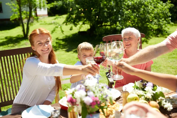 Happy family having dinner or summer garden party — Stock Photo, Image