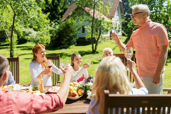 Family gathering at summer garden and celebration — Stock Photo, Image