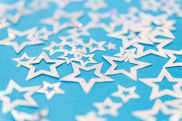 Estrella en forma de decoración confeti sobre fondo azul — Foto de Stock