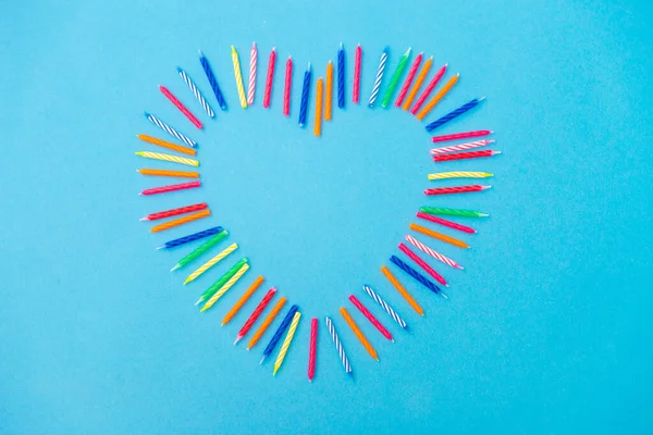 Frame of birthday candles in shape of heart Royalty Free Stock Images