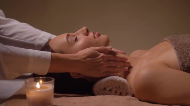 Woman having face and head massage at spa — Stock Video