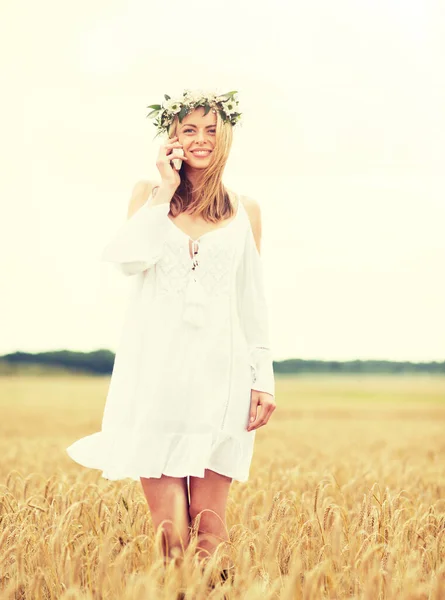 Happy young woman calling on smartphone at country — Stock Photo, Image