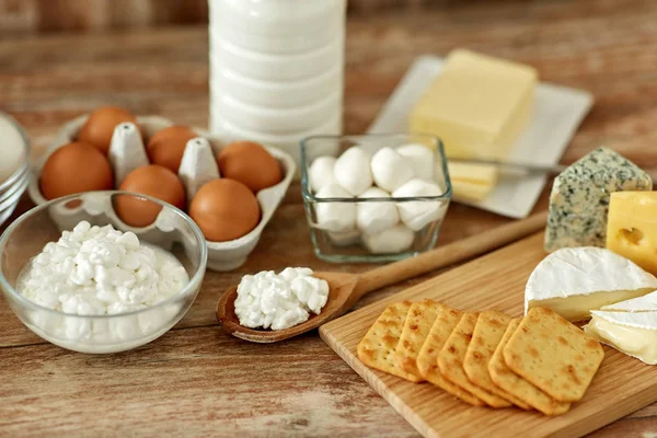 Cottage cheese, crackers, milk, yogurt and butter — Stock Photo, Image