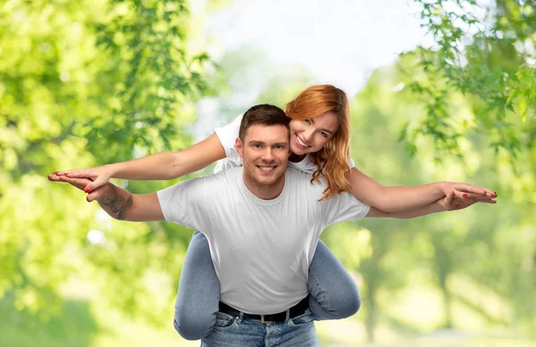 Happy couple in white t-shirts having fun — Stock Photo, Image