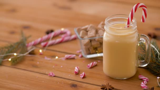 Glass mug of eggnog, ingredients and sweets — Stock Video