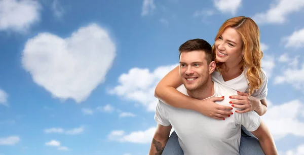 Happy couple in white t-shirts having fun — Stock Photo, Image