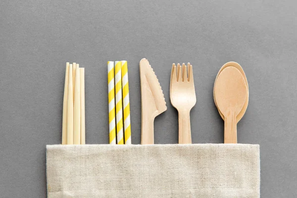 Wooden spoon, fork, knife, straws and chopsticks — Stock Photo, Image