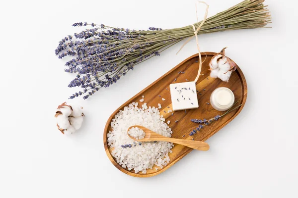 Sea salt, lavender soap and moisturizer on tray — Stock Photo, Image