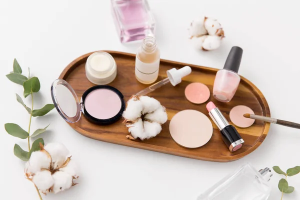 Makeup, perfume and cosmetics on wooden tray — Stock Image Makeup, perfume and cosmetics on wooden tray Royalty Free Stock Photos