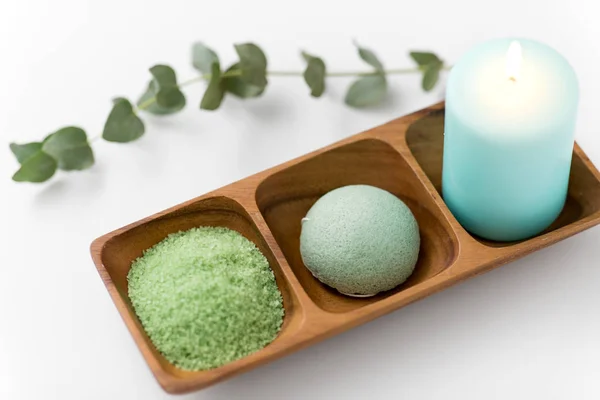 Bath salt, konjac sponge, candle and eucalyptus — Stock Photo, Image