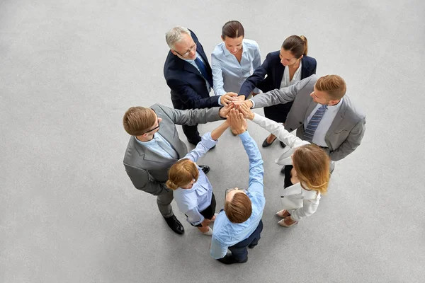 Business people making high five in office Stock Photo