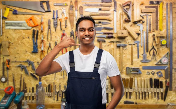 Happy worker or builder making phone call gesture — Stock Photo, Image