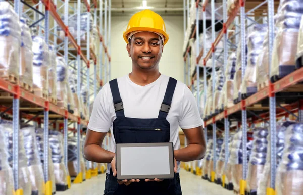 Happy indian worker with tablet pc at warehouse — 스톡 사진