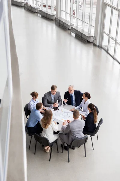 Architects with laptop and blueprint at office — Stock Photo, Image