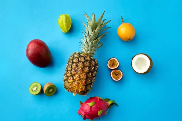 Pineapple with other fruits on blue background — 스톡 사진