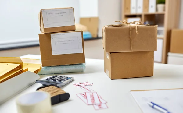 Parcel boxes on table at post office — 스톡 사진