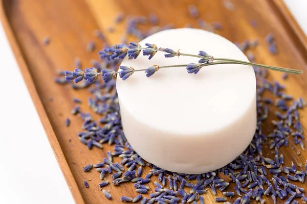 Close up of crafted lavender soap on wooden tray Stock Image