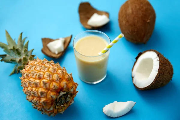 Pineapple, coconut and drink with paper straw — 스톡 사진