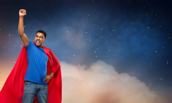 Indian man in superhero cape over night sky — 스톡 사진