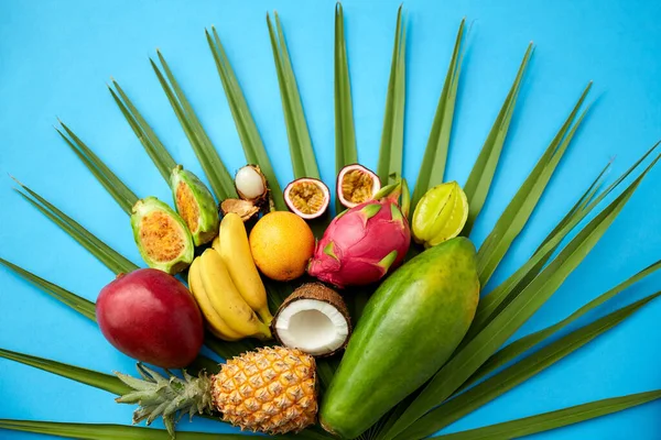 Different exotic fruits on blue background — 스톡 사진