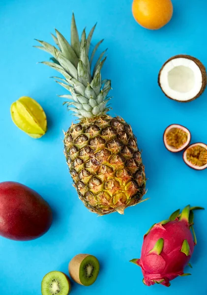 Pineapple with other fruits on blue background — 스톡 사진