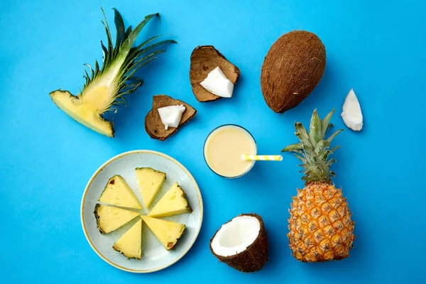 Pineapple, coconut and drink with paper straw — 스톡 사진