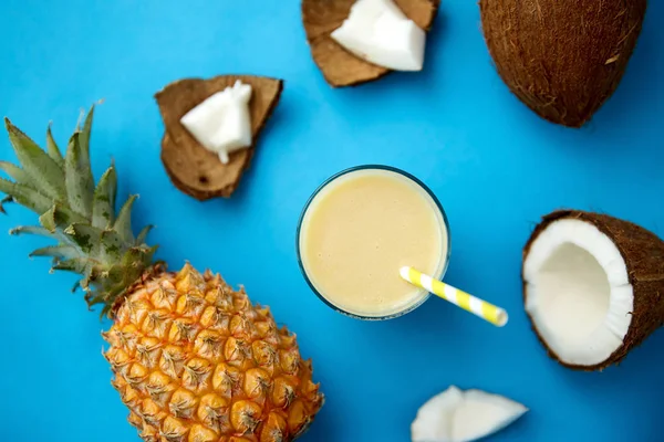 Pineapple, coconut and drink with paper straw — 스톡 사진