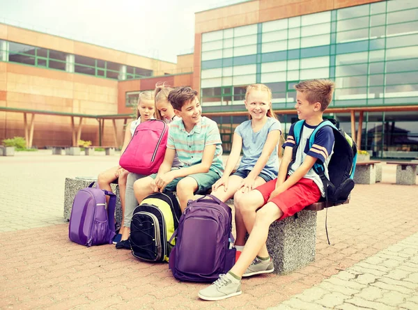 Group of happy elementary school students talking Royalty Free Stock Images