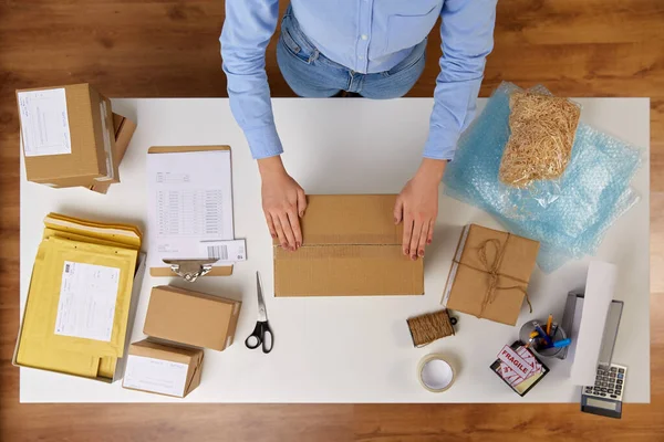 Woman packing parcel box with adhesive tape — 스톡 사진