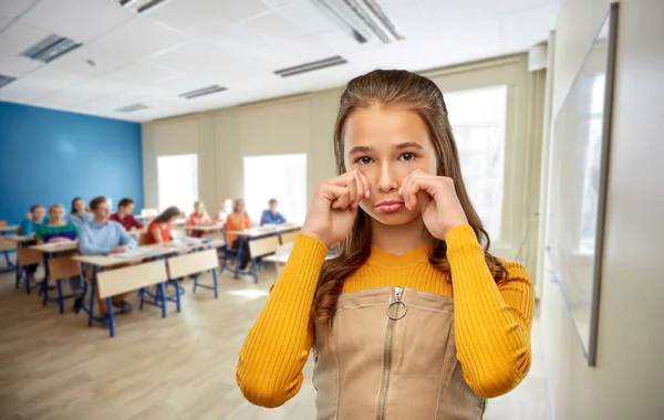 Unhappy teenage student girl crying at school — 스톡 사진