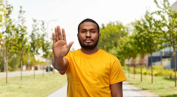 African american man showing stop gesture outdoors — Stock Photo, Image