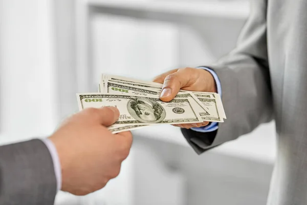 Close up of businessmens hands holding money — Stock Photo, Image