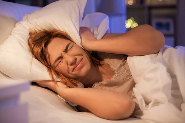 Annoyed woman suffering from insomnia at night — Stockfoto